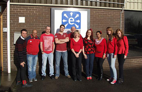 Extract technology staff wearing red for the british heart foundation